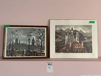 Framed print of London cityscape with Big Ben and River Thames, next to unframed print of Neuschwanstein Castle, both with green price stickers