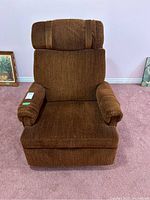 Front view of brown rocking recliner chair with padded armrests and cushioned headrest.