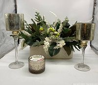 Full set showing winter centerpiece base, two mercury glass candle holders, and Christmas Cottage scented candle arranged in a studio light box.