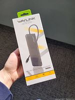 Front view of WavLink USB-C Multi Display Docking Station packaging, showing slim rectangular device graphic and branding.