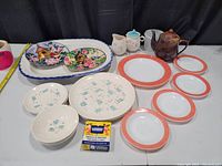 Photo showing full lot with all plates, teapot, cream and sugar set, and antique platter clearly visible