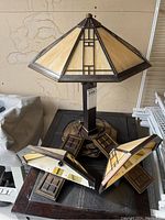 Full view of table lamp with matching wall sconces displayed together