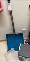 Yardworks snow shovel with blue broad scoop and gray handle with logo