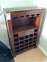 Front view showing entire wine rack with glass hangers, shelf and bottle grid