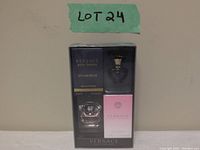 Front view of the sealed package showing two Versace miniature bottles, Dylan Blue Eau De Parfum and Bright Crystal Eau De Toilette, with labeling and packaging clearly visible.