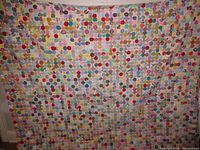 Full front view of quilt laid out to show overall pattern and dimensions