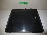 Top view of Nikko turntable with closed dust cover, showing NIKKO branding and linear tracking indication.