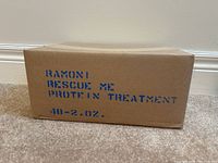 Photo of sealed cardboard box labeled with product and quantity details.