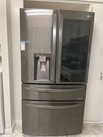 Front view of closed LG French door refrigerator
