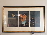 Frontal view of the framed triptych print showing all three panels with cream mat and gold-and-black frame