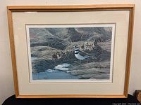 Full view of the framed print showing the entire artwork and frame.