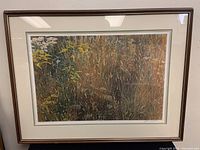 Framed full view of the Robert Bateman print showing the meadow scene in a brown wooden frame with a light-colored mat.