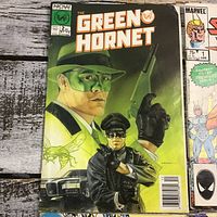 Green Hornet #2 comic book with illustrated cover showing masked man with pistol and another in black outfit.