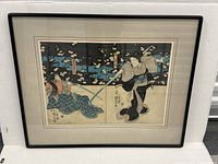 Both prints side by side in black wood frame on white background