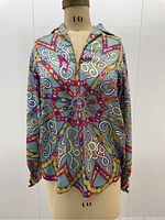 Front view of blouse on mannequin showing collar, print alignment and hemline