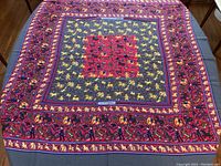 Full view of square shawl laid flat showing entire Chasse en Inde pattern
