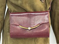 Front view of bag on mannequin torso for scale