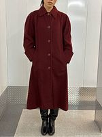 Front view on model showing coat length, color, button front, side pockets
