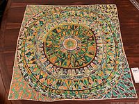 Full view of the laid-out square scarf showing overall pattern and color scheme