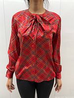 Full front view on model, tie knotted at neckline