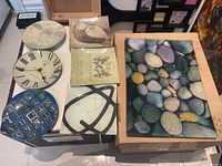 Overall view of the collection showing all eight plates including the large river rocks platter, various round plates with distinct designs, and the small square plates with modern abstracts.