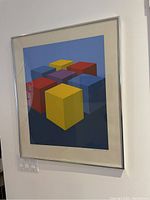 Overall view of framed Cube Group print hung on wall