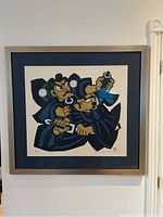 Full view of framed Japanese print by Mori Yoshitoshi showing two samurai in blue robes, silver-tone frame, blue mat.