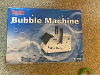 Box front showing Antari Bubble Machine B-100 model with blue bubble-themed background