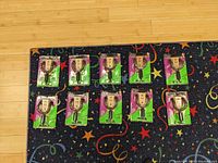 Top-down view showing all 10 guitar hangers still in their original packaging laid out on floor.