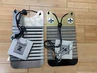 Two mini standard zydeco rubboards side by side, each with leather thong and metal keys, branded Key of Z