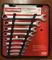 Photo of a new Craftsman 9-piece combination wrench set in original packaging with holder, showing sizes from 3/8" to 3/4".