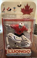 Photo of unopened Roberto Luongo McFarlane figurine in packaging, showing Team Canada uniform and 2010 Vancouver Olympics branding.