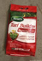 Full view of unopened Scotts Turf Builder Weed Prevent 9.1kg bag with front facing showing product branding and dandelion image.