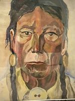 Close-up image showing the detailed watercolour portrait of an Indigenous male, focusing on facial features and earrings.