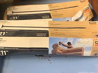 Two boxes of Simpson Strong-Tie 11-inch SDWS log screws, original packaging with one box collapsed but intact, showing product branding and size details.