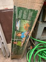 Boxed Melissa & Doug Sunny Patch Kids Picnic Table, shows label with product features and images of children using table with umbrella