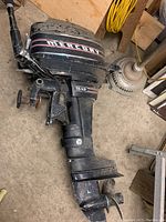 Side view of Mercury 7.5 HP outboard motor showing full unit from cowling to propeller.