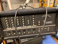 Front and top view of Yorkville MP6T powered mixer showing input channels, control knobs and audio jacks.