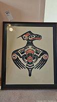 Full framed print showing the Thunderbird indigenous art in black, red, and white.