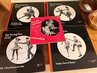 Four Time Life The Swing Era box sets and one red and white Columbia LP empty sleeve of Erroll Garner Gems shown together on a wooden surface.