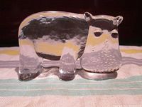 Side view of clear glass hippo figurine showing body shape and details