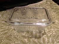 Top view of the rectangular glass container with lid showing sunburst pattern on lid top.