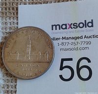 Obverse side featuring Canadian Parliament building, 'CANADA 1939 DOLLAR' inscription.