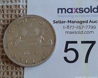 Reverse side showing canoe design and date 1962