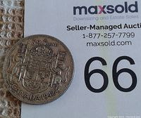 Reverse of the 1942 Canadian silver half dollar with Canadian coat of arms and denomination