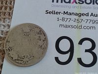 Reverse side of the same 1916 Canadian quarter featuring the denomination '25 CENTS' with maple leaves around the edge.