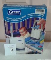 Front of original blue box packaging showing Gerry Ultra-Sensitive Nursery Monitor with image of baby and product units, includes model number 611.