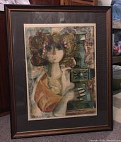 Full view of the framed print depicting a stylized portrait of a woman holding a candlestick, housed in a dark wood frame with matting.