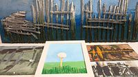 Close detail of triptych with wooden stick textures and blue background.