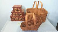 View of two woven Longaberger baskets and three-drawer wooden vanity box